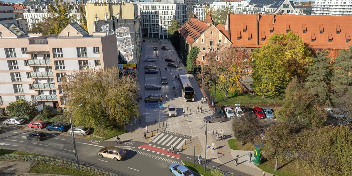 Wizualizacja przedstawia przebieg planowanej drogi rowerowej w rejonie ul. Cieszyńskiego i Nowy Świat. Na grafice widoczny jest przejazd rowerowy, który łączy nową drogę rowerową z tzw. rowerową ulicą (jezdnia współdzielona przez rowerzystów i samochody).