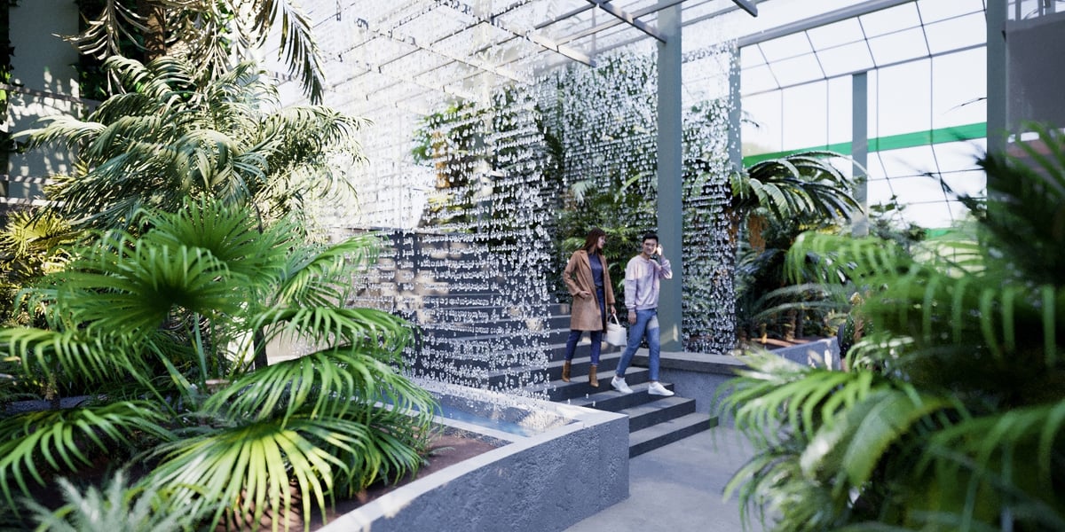 Nowa Palmiarnia w Ogrodzie Botanicznym we Wrocławiu. Na ilustracji wnętrze pełne roślin i para spacerujących ludzi