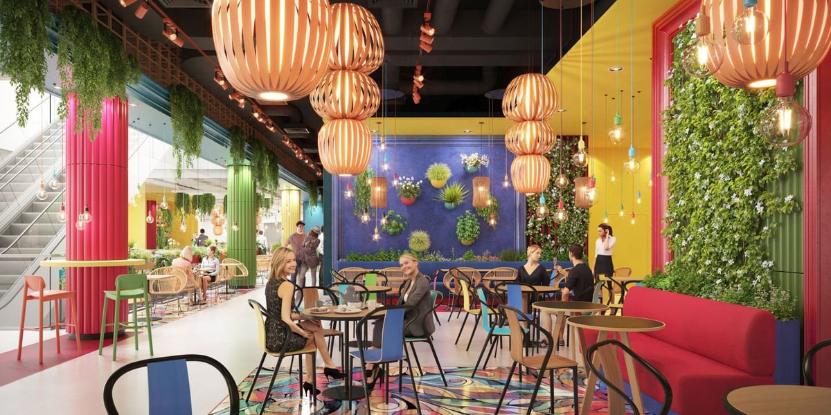 Wizualizacja części strefy gastronomicznej w Sky Towerze (inspirowana Fridą Kahlo). Widać na niej ażurowe klosze, stoliki i siedzących przy nich ludzi, rośliny na ścianach