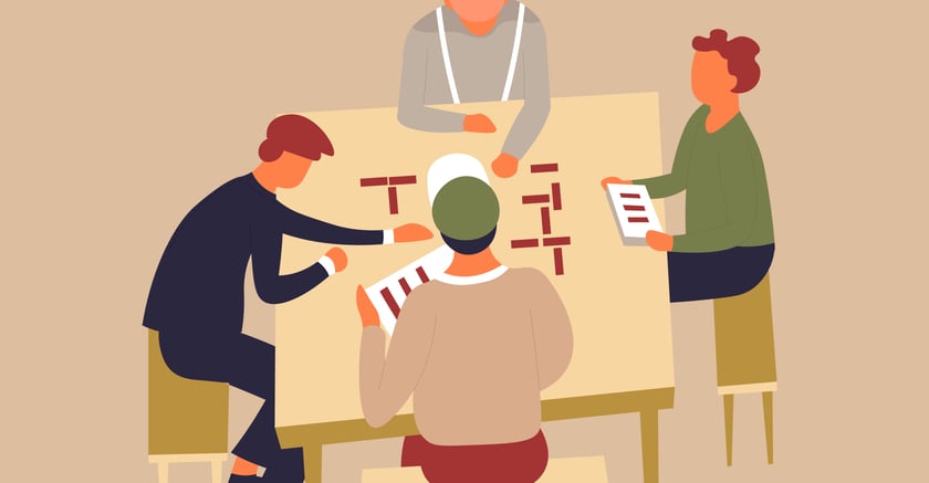 Powiększ obraz: Grafika przedstawia cztery postacie przy stole.