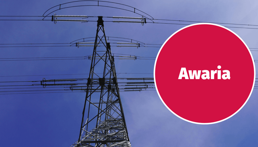 Słup energetyczny, obok niego napis w kółku: Awaria