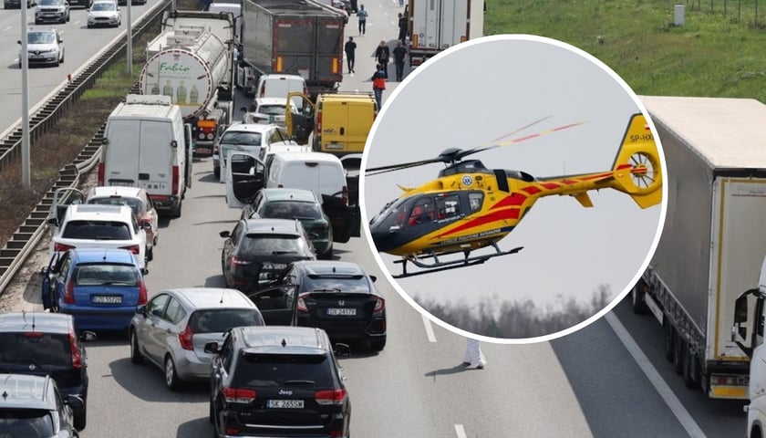 Samochody stojące w korku na autostradzie, w kółku helikopter LPR, zdjęcie ilustracyjne 