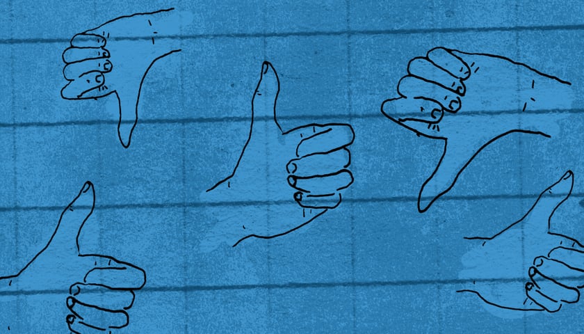Rysunek przedstawiający kciuki skierowane w górę i w dół, grafika ilustracyjna.