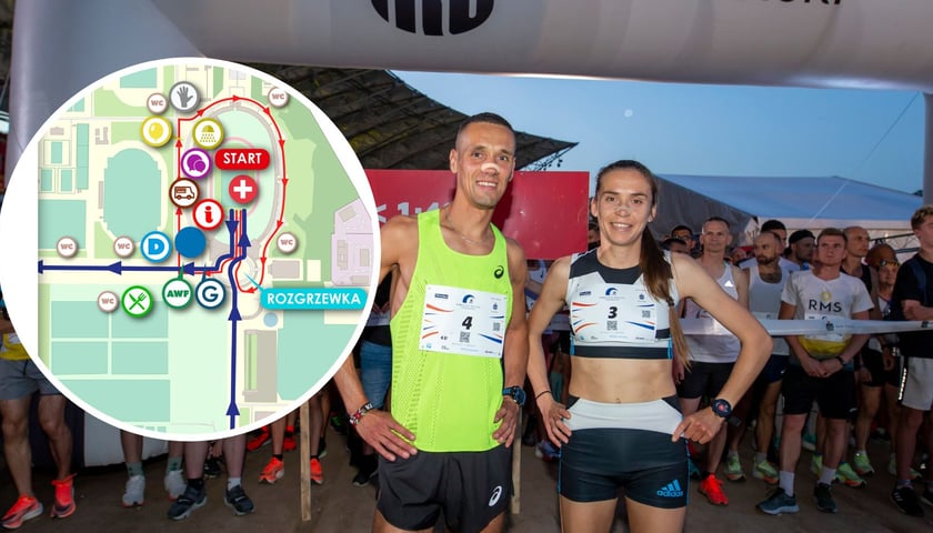 Na zdjęciu uczestnicy wrocławskiego nocnego półmaratonu z 2022 r. W kółku mapa miasteczka półmaratonu na Stadionie Olimpijskim / zdjęcie ilustracyjne