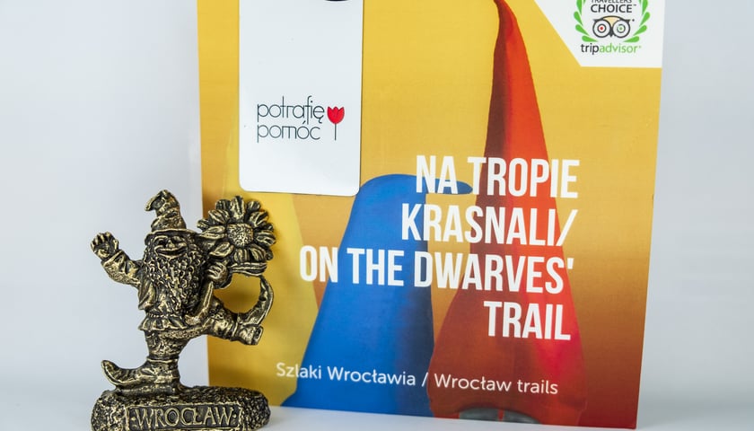 <p>Mapka wrocławskich krasnali oraz mosiężny krasnal Życzliwek</p>