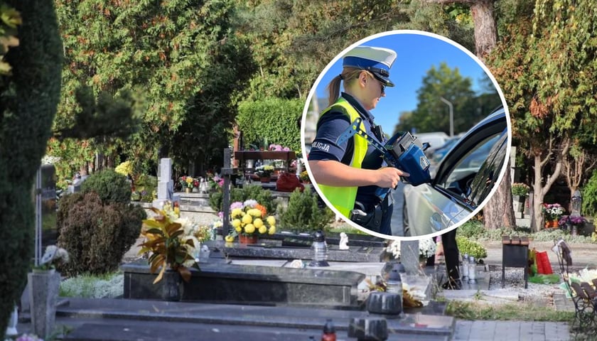 Cmentarz, w kółku policjantka w mundurze podczas kontroli kierowcy