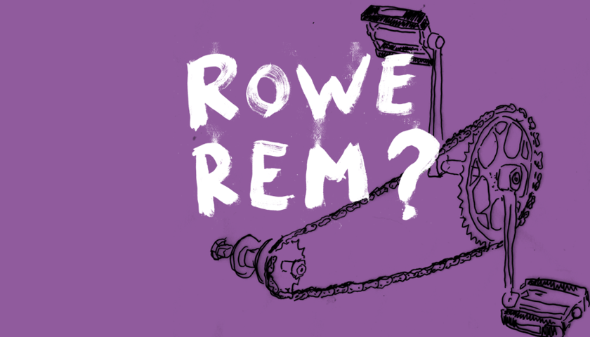 Napis" "Rowerem?" W tle rysunek łańcucha rowerowego z pedałami.