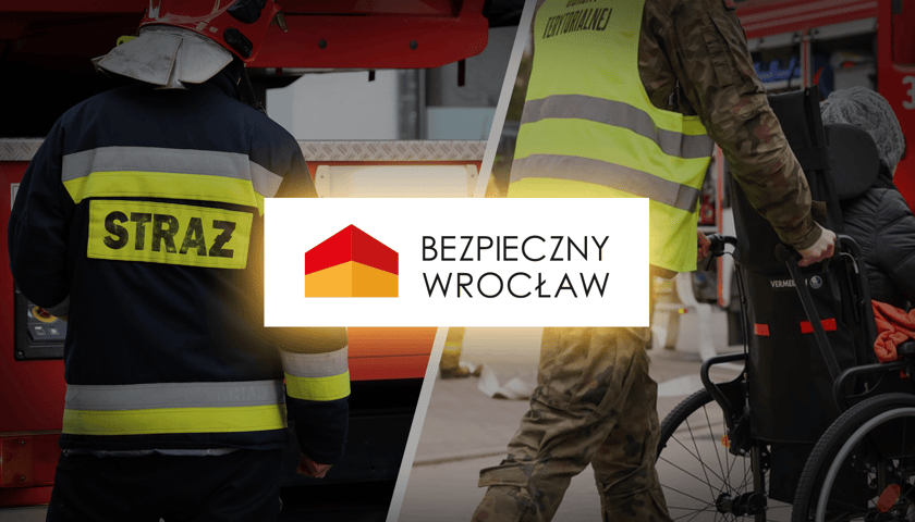 Na zdjęciu członek Straży Pożarnej oraz wolontariusz prowadzący osobę na wózku wraz z logiem Bezpieczny Wrocław. Sprawdź najnowsze komunikaty od miasta oraz pilne ogłoszenia Centrum Zarządzania Kryzysowego.