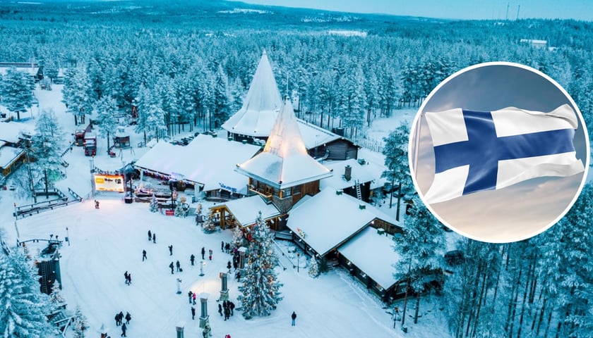 Fińska wioska zimą, w owalu fińska flaga