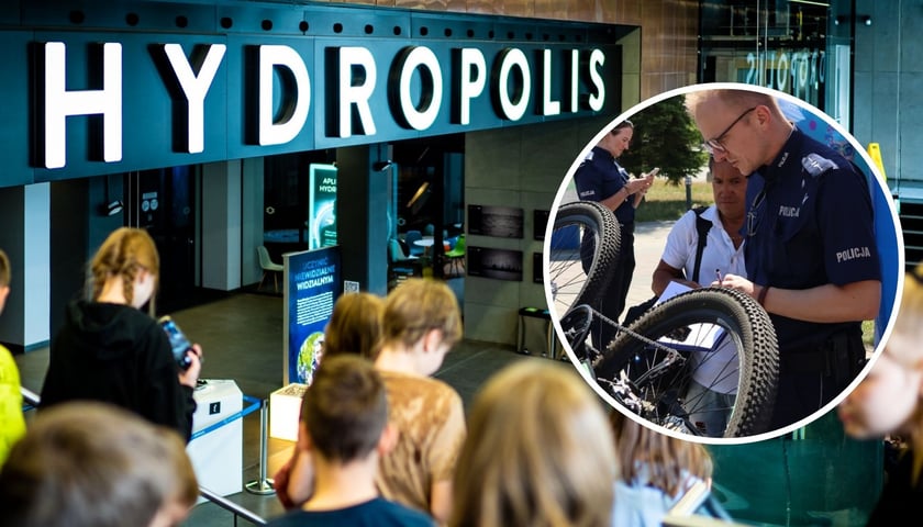 Dzieci przed wejściem do Hydropilis, w kółku policjant w mundurze znakuje rower