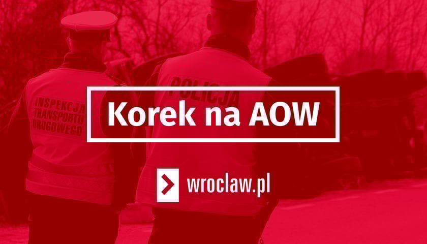 Czerwona plansza z białym napisem - korek na aow