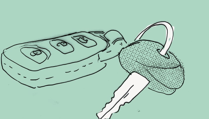 Kluczyki samochodowe na zielonym tle. Grafika ilustracyjna.