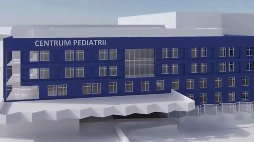 Wizualizacja Zintegrowanego Centrum Pediatrii USK. Na grafice jest jasny budynek z oznaczonym na niebiesko oddziałem
