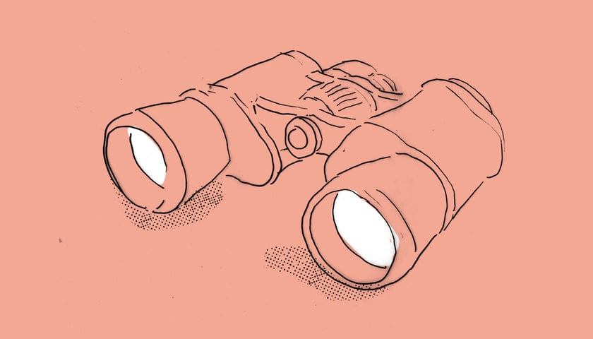 Motyw lornetki na pomarańczowym tle. Grafika ilustracyjna.