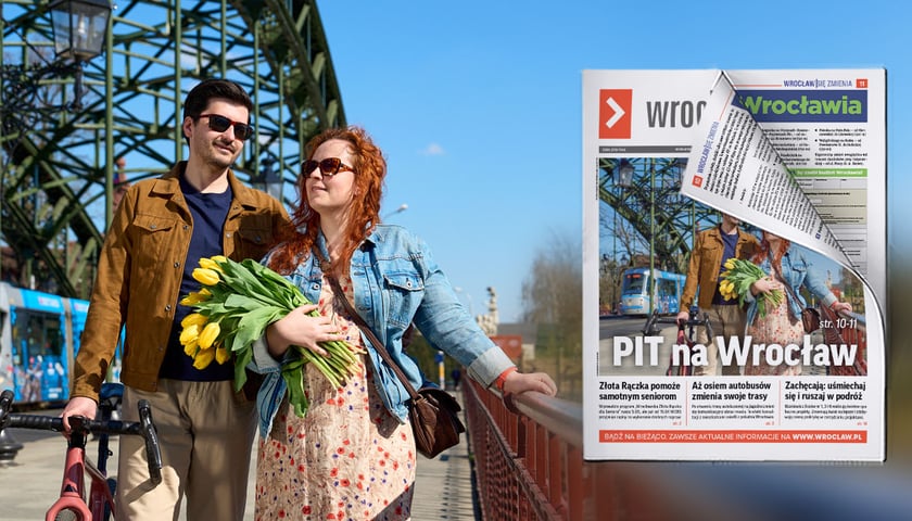 Para spacerowiczów: młody brunet i młoda rudowłosa kobieta na wyremontowanym moście Zwierzynieckim
