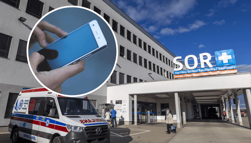 Budynek szpitala przy ul. Fieldorfa z napisem SOR przy wejściu, przed nim stoi karetka. W kółku z lewej strony smartfon w dłoniach