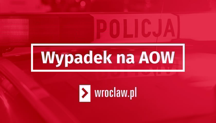 czerwona plansza, w ramce napis: wypadek na AOW