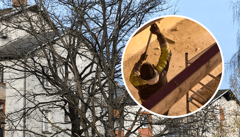 Jeden z budynków, gdzie będzie remont dachu, w kółku pracownik budowlany przygotowujący strych do remontu