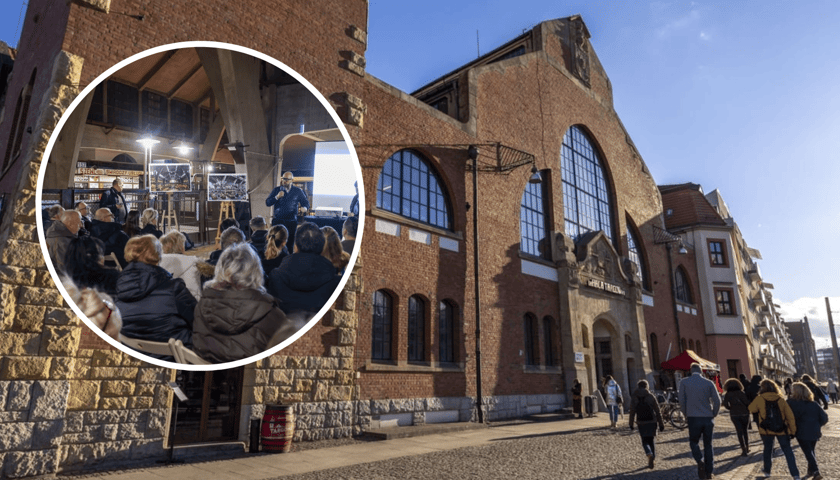 W tle budynek Hali Targowej, w kółku z prawej kupcy i prezydent Jacek Sutryk podczas spotkania 20 stycznia - kilkadziesiąt osób siedzących na krzesłach.