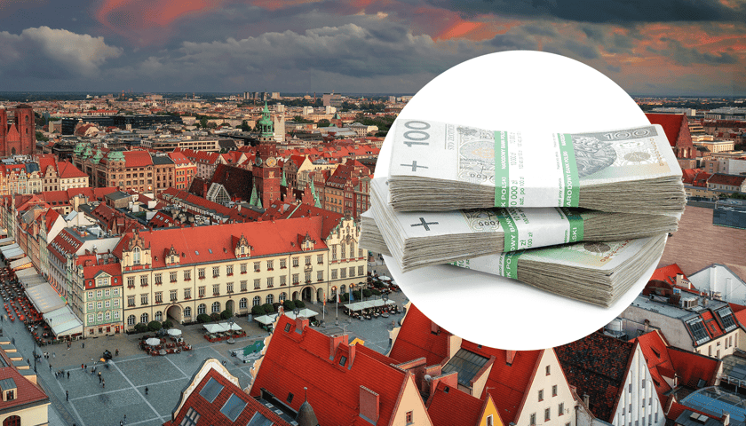 Panorama Wrocławia, w kółku plik banknotów